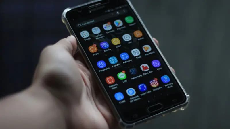 A person holding a phone, ready to get started