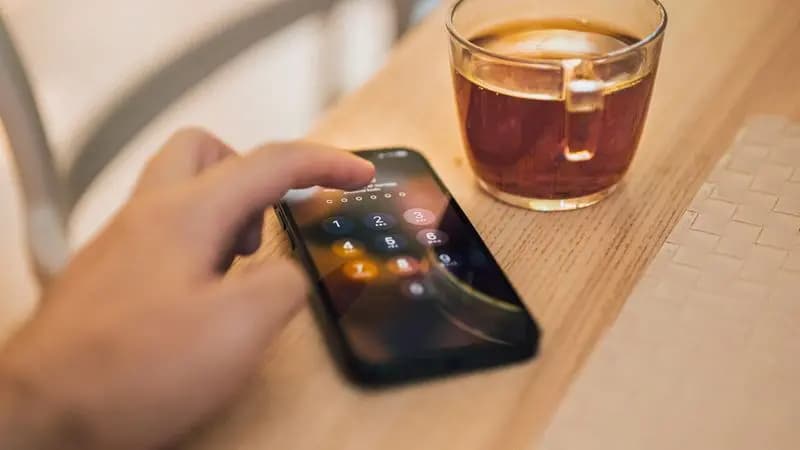 A hand unlocking a phone