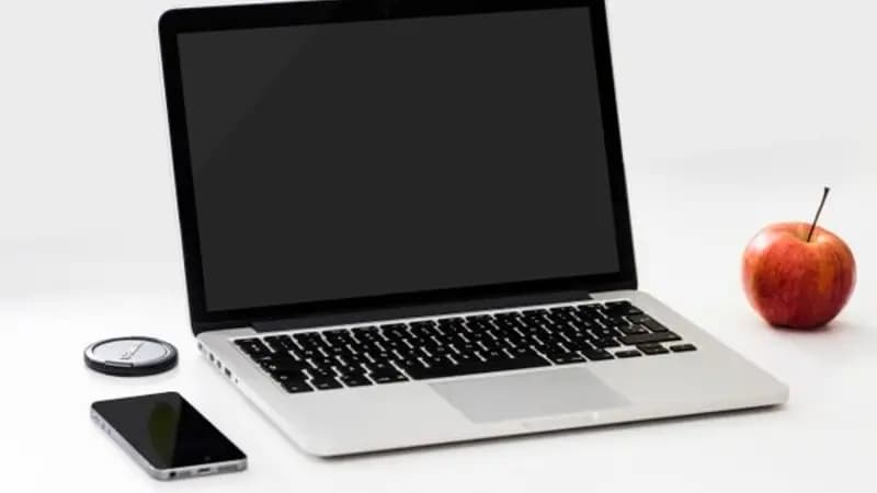 A laptop open on a desk